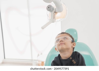 A Child Playing In Dentist´s Office. Dental Treatment In A Children's Clinic.