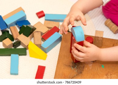 Child Playing With Old Building Blocks