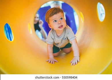 the child playing on the color playground - Powered by Shutterstock