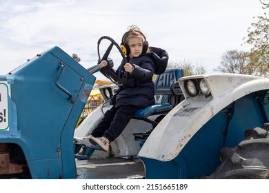 Child Playing On A Farm. Little Farmer, Truck Driver