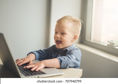 Child Playing On Laptop