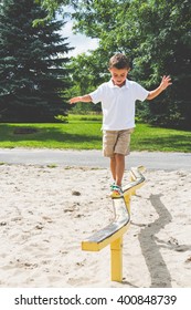 Child Playing On The Park Play Structure Balance Beam