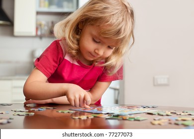 Child, playing puzzles at home