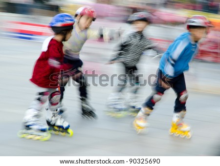 child playing rollerblade blur motion