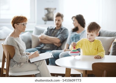 Child Playing With Spinning Top ADHD Therapy With Parents