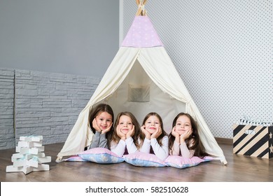 Child Playing With A Teepee