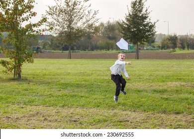 Child Playing Throwing A Paper Airplane