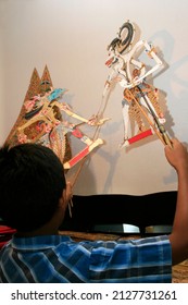 Child Playing Wayang Kulit Or Shadow Puppet