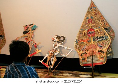 Child Playing Wayang Kulit Or Shadow Puppet