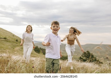 Child Plays Catch With His Mom And Aunt