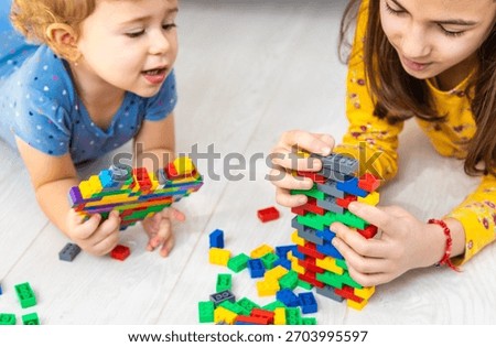 The child plays as a constructor. Selective focus. Kid.