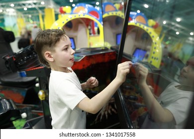 Child Plays Game On Large Touch Screen In Amusement Park