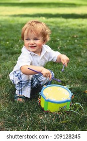 Child Plays On A Drum