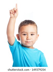 Child Pointing Up With The Finger On A White Background