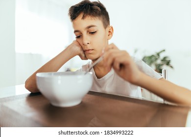 Child With Poor Appetite During The Meal. Concept Of Lack Of Appetite.