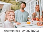 Child, portrait and family with lunch outdoor for holiday celebration, brunch and waiting for food with bonding. Girl, people and dinner event on patio in festive season with relax, fun and happy