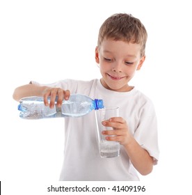 Child Pouring Water In A Glass Isolated On White