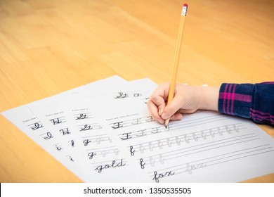 Child Practicing Cursive Writing.