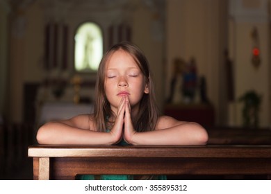 Child Praying In Church 