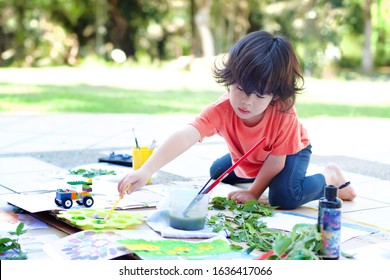 Child Preschooler Drawing And Painting A Car.Young Artist Boy At Work.Creativity And Learning In Children.Asian Kid Playing With Color Paints.Car Bricks.Outdoor Art Activity.