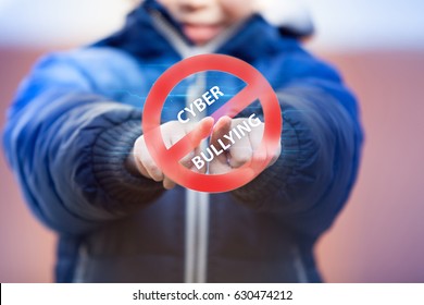 Child Pressing Cyberbullying Stop Symbol On Virtual Touch Screen. Cyberbullying Awareness.