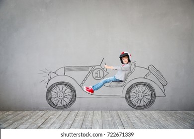 Child Pretend To Be Businessman. Kid Playing At Home. Child Driving Imaginary Retro Racing Car. Imagination, Idea And Success Concept