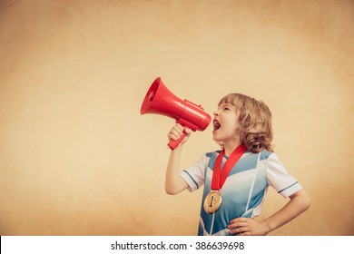 Child is pretending to be a soccer player. Success and winner concept - Powered by Shutterstock