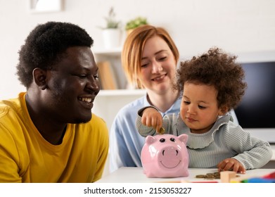 Child Is Putting A Coin Into A Piggy- Bank. Savings Bank Accounts For Kids Concept. Kid Saving Money For Future Concept.