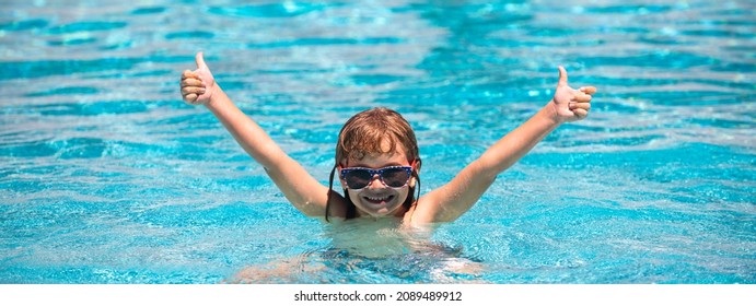 Child Raised Hands In Summer Swimming Pool. Active Kids Healthy Lifestyle, Water Sport Activity And Swimming Lessons On Summer Vacation With Child. Banner, Copy Space.