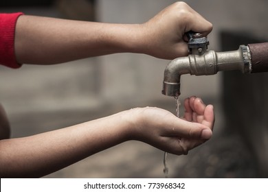 Child Reach Out Waiting For Water, Water Shortage Concept.