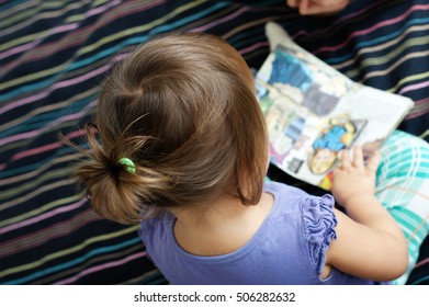 Child Reading Book With Fairy Tales Sitting, Top View