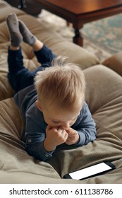 A Child Is Reading A Smartphone