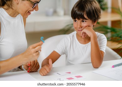 Child Recognizing Numbers In A Preschool Assessment Test.