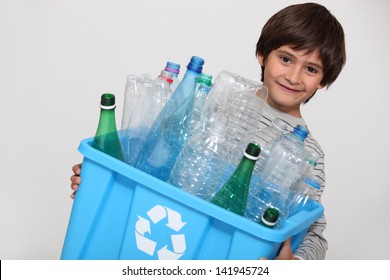 Child Recycling Plastic Bottles