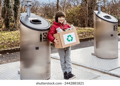 Child recycling plastic and glass waste at the recycling center with special garbage bins outdoors. Sustainable lifestyle, children education - Powered by Shutterstock