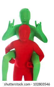 Child In A Red Body Suit Carrying A Kid In A Green Body Suit On Her Back.