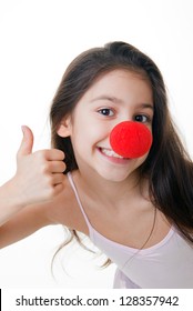 Child With Red Clown Nose Thumbs Up