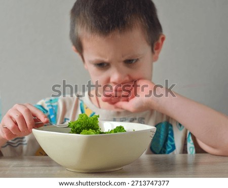 Child refusing vegetables - Picky eater child with bowl of broccoli
