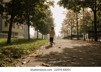 a child rides a scooter rear view	
 - Shutterstock ID 2259110051