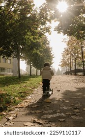 a child rides a scooter rear view	
 - Shutterstock ID 2259110117