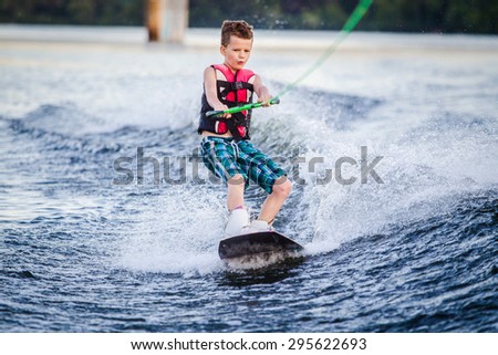 A child riding in the Wakeboarding