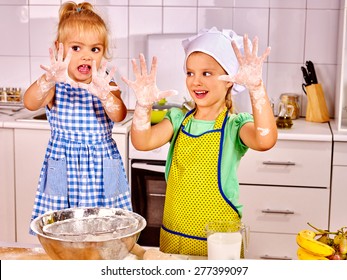 Child With Rolling-pin Dough At Kitchen. Messy Kids