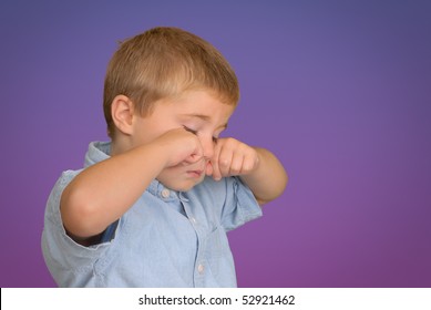 Child Rubbing His Eyes