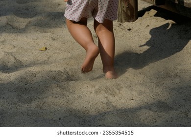 A child running around the playground. - Powered by Shutterstock