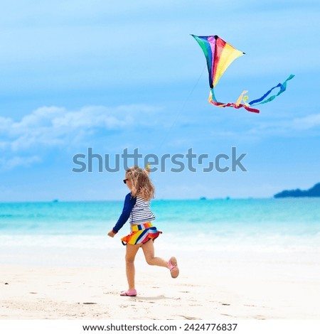 Similar – Image, Stock Photo Flying rainbow kites coast