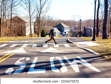 Child Running On Crosswalk. Boy Runs Across The Road In Front Of The Car