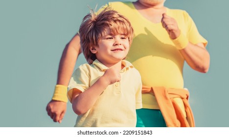 Child Running In Stadium. Kid Run On Outdoor. Jogging For Kid. Father And Son Play Sports And Run. Healthy Sport Activity For Children. Sport For Kids, Active Child Running. Healthy Family Concept.