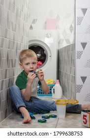 Child Safety Concept. Kid Plays And Eats Deadly Capsules For Washing