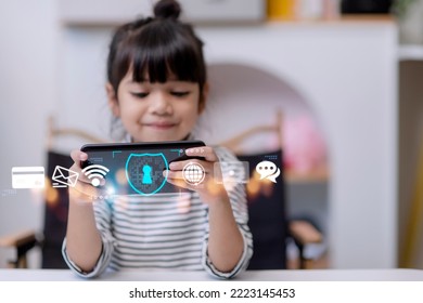 Child safety online. Little girl using smartphone at home. icon of internet blocking app on foreground - Powered by Shutterstock