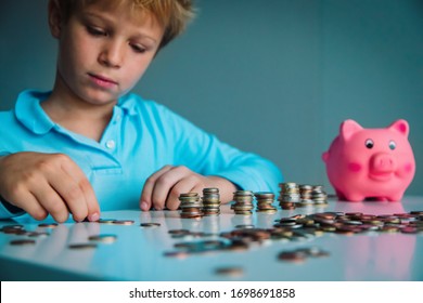 Child Saving Money, Boy Put Coins Into Piggy Bank